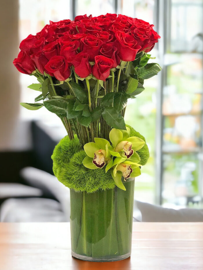 Red Roses and Green Orchids Flower Arrangements